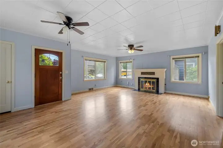 Bright living space! Original millwork and wrapped windows