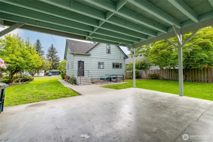 Back of home view through carport
