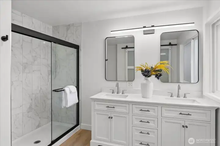 Double vanity bath designed with clean finishes and plenty of storage