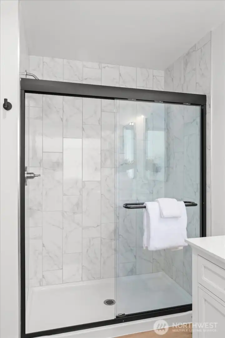 Beautifully updated bathroom with oversized shower and modern finishes and the