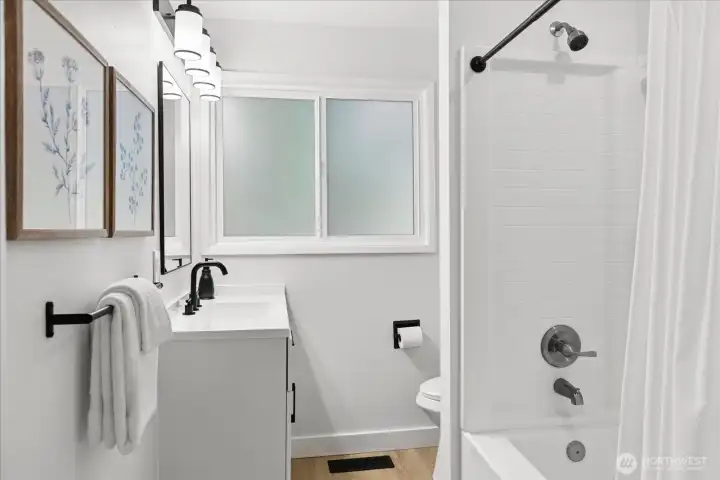 Updated main floor bathroom with fresh finishes and a clean modern look