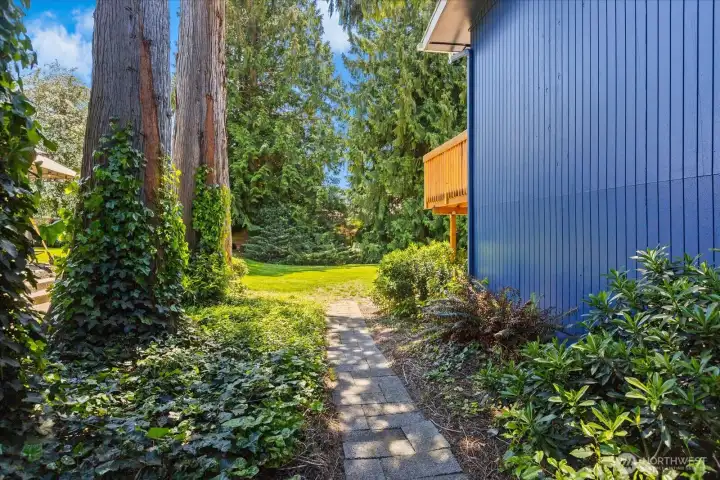Peaceful backyard setting with mature landscaping and natural privacy