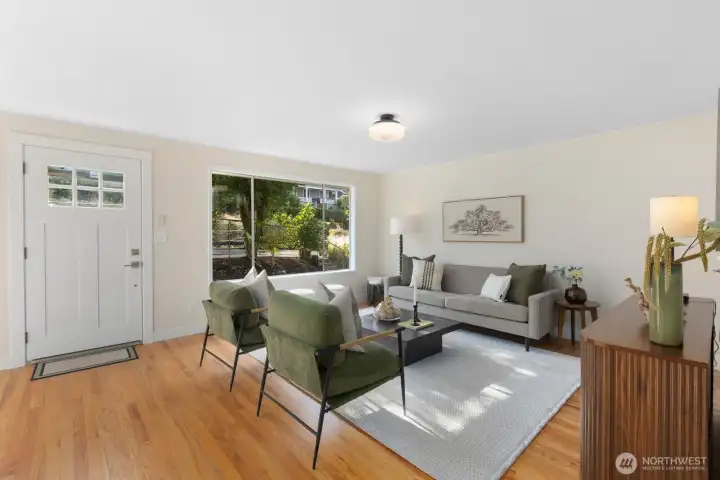 Freshly refinished original hardwood floors and fresh paint throughout main level