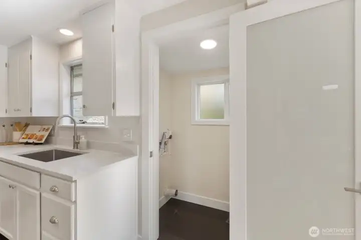 Rare walk-in pantry features washer/dryer hookups for separate level living/rental potential if desired