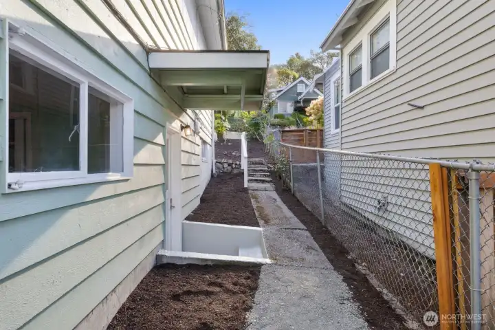 The north side of the home features an additional lower level entry