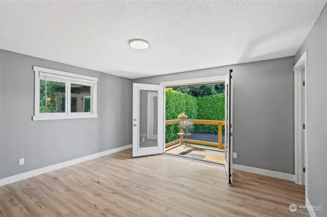 Primary Bedroom has French doors that lead out to back deck