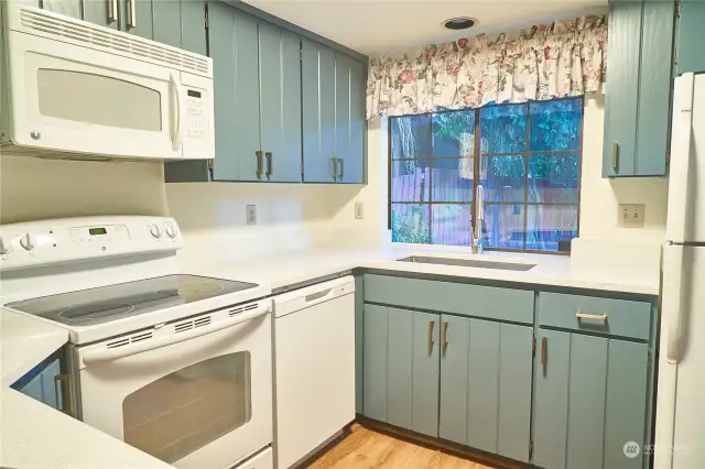 New kitchen counters and freshly painted cabinets