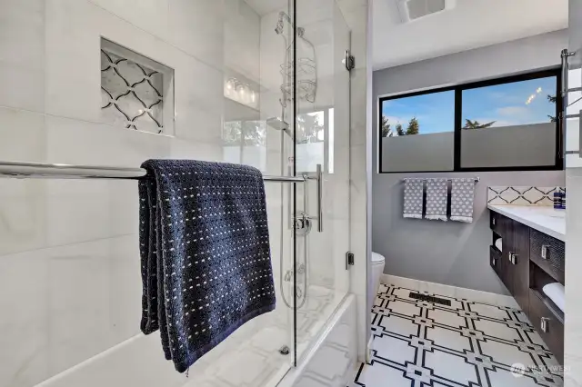 2nd full bathroom on a main floor with beautiful tile work.