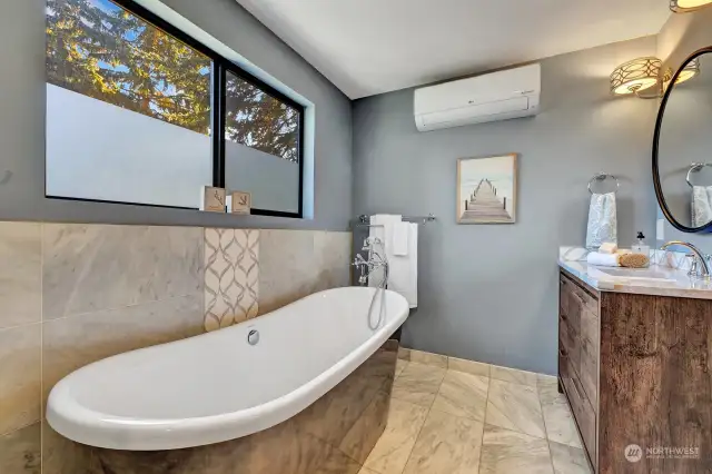 Beautiful tub in primary bath. There is also a mini-split for your comfort