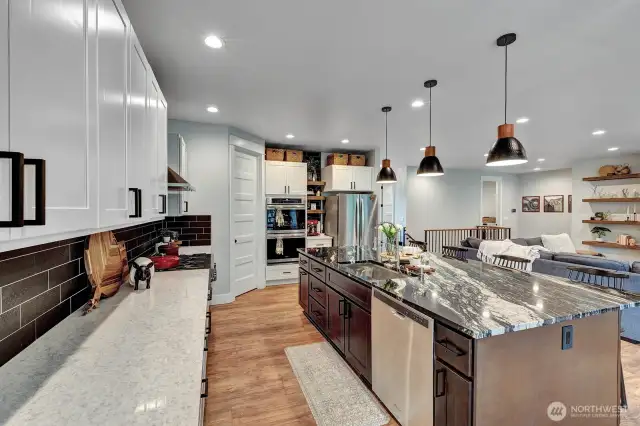 Large granite countertop Island, 9’3” x 5’3” with KRAS Workstation, 33” Stainless steel sink with accessories makes for easy food prep.