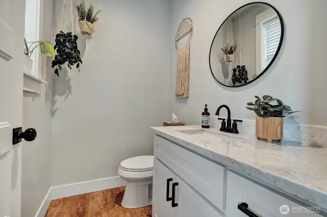 Guest half-bath, this space feels both stylish and welcoming.