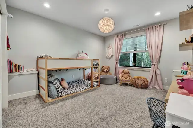 Step into a spacious bedroom that embodies exquisite design. (1st lower level room)