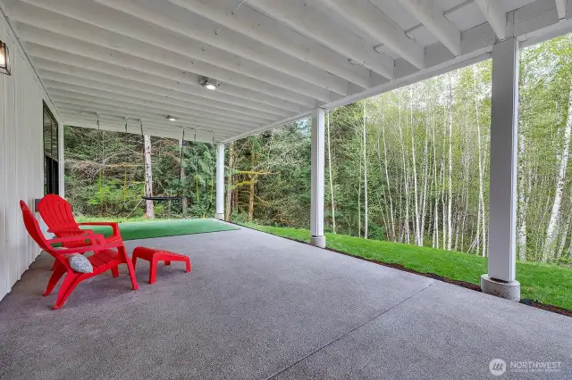 This substantial covered space offers protection from the elements, allowing you to savor the fresh air and connect with your surroundings regardless of the weather. Wired for hot tub.