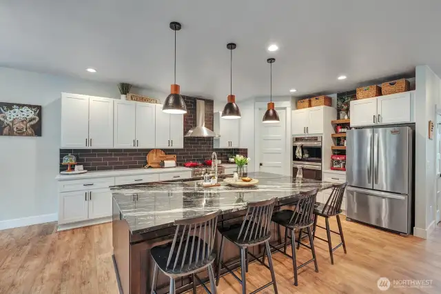 The kitchen is a chef's dream, meticulously designed with top-of-the-line appliances and ample space to create culinary masterpieces.