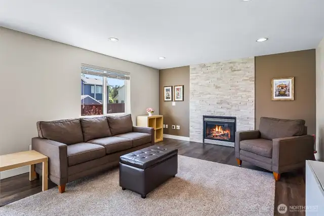 Adjacent to the kitchen is the family room with gas fireplace.