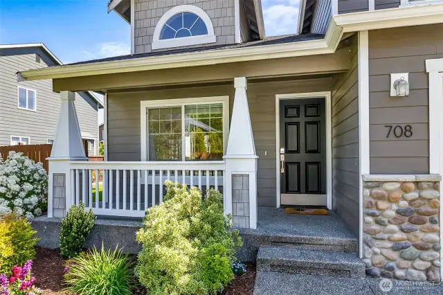 A covered front porch greets you.