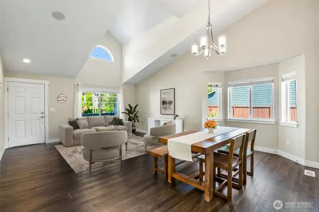 Enter to the vaulted living and formal dining area with bay window that overlooks the side yard.