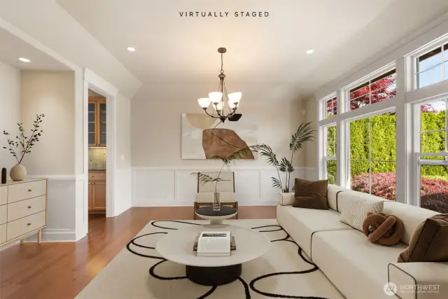 Formal front room by entry virtually staged.