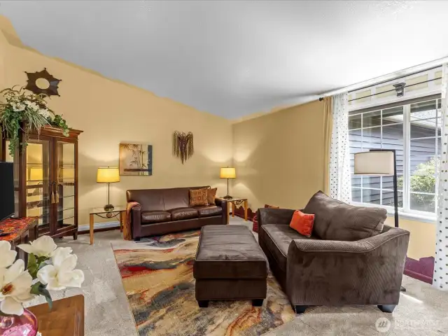 The living room gets lots of light with big windows and vaulted ceilings.  It's a feel-good space!