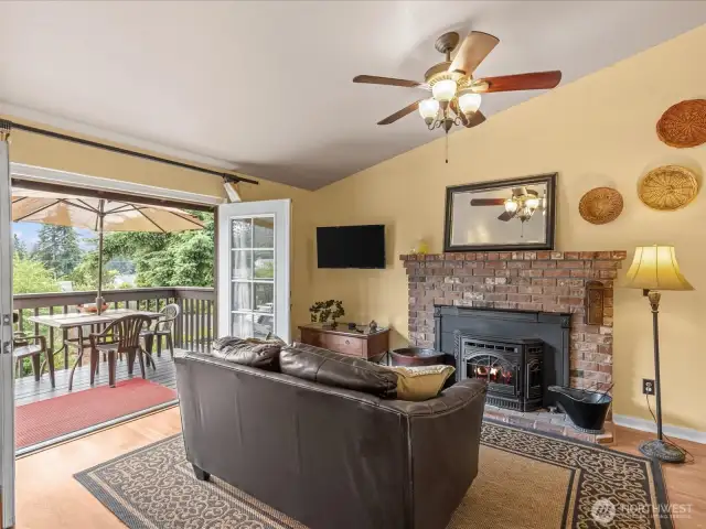 Check out the cozy family room with pellet stove.  This has been the favorite space in the home for many years.  A fun place to make and eat popcorn.  The frenchdoors lead seamlessly out to the deck.