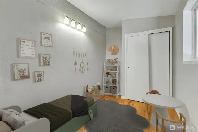 This smallish bedroom is virtually staged and is off the dining room