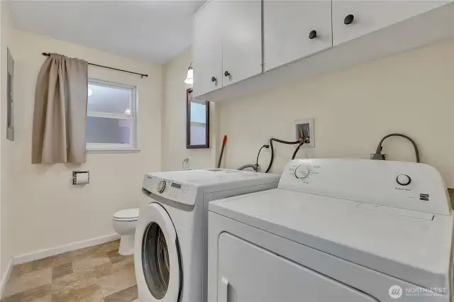 Laundry and half bath with nice storage