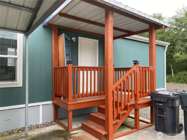 Covered entry by carport