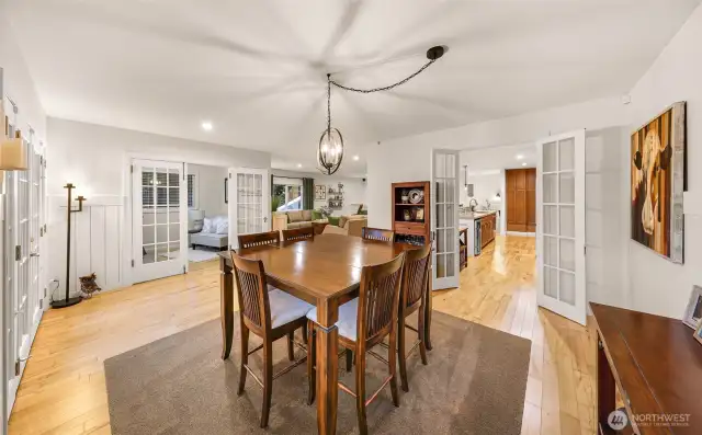 Looking back towards the kitchen. Both sets of french doors, the ones leading to the kitchen and the ones leading to the den/office are a little piece of history showcasing the original craftmanship & patinaed brass hardware.