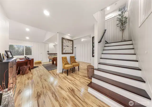 Lets step down these custom made stairs to the second living space; the "game room".