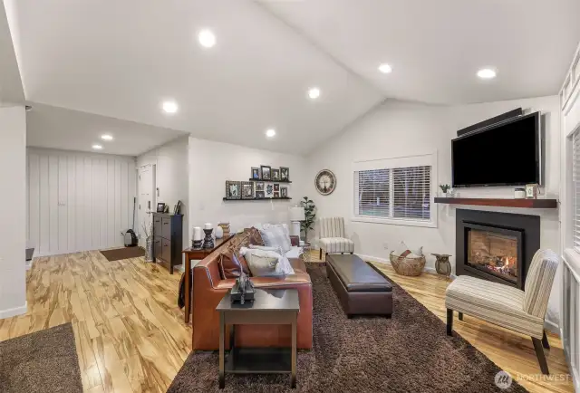 Behind this huge TV is a spacious, two level cubby with power for all your audio/visual equipment and game consoles. That solid wood mantel over the fireplace, yes it does match the free-floating bar by the pool table.
