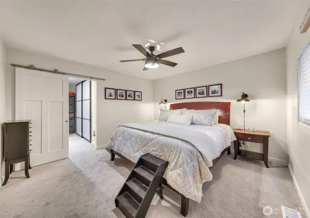 A stylish and elegant primary bedroom is your place to restore after a long soak while taking in the views or stars from your hot tub. This is a California King sized bed for perspective.