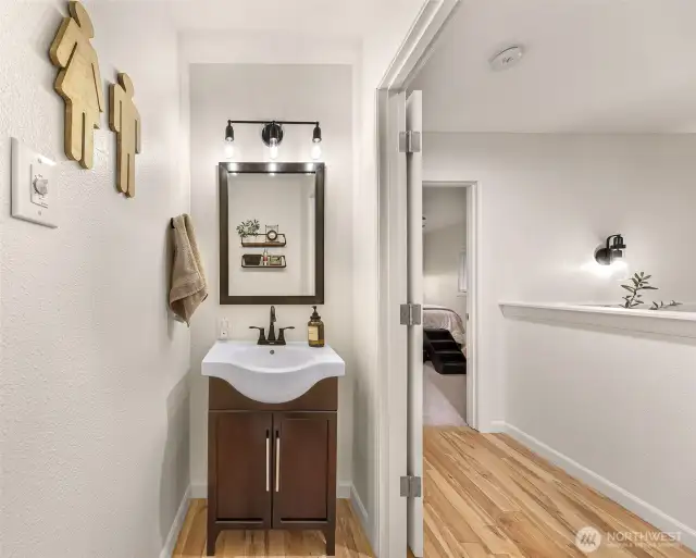 Elegant and convenient, the powder room is just off the living room.