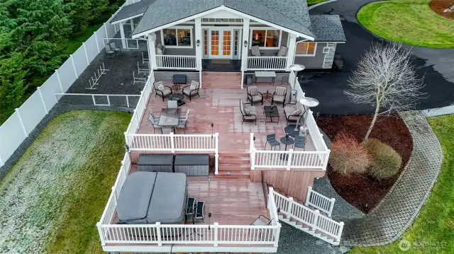 The planting area to the right of the deck feature a beautiful elm tree with contrasting green leaves and a spalted maple. The third plant is beautiful too, we just don't remember what it is.