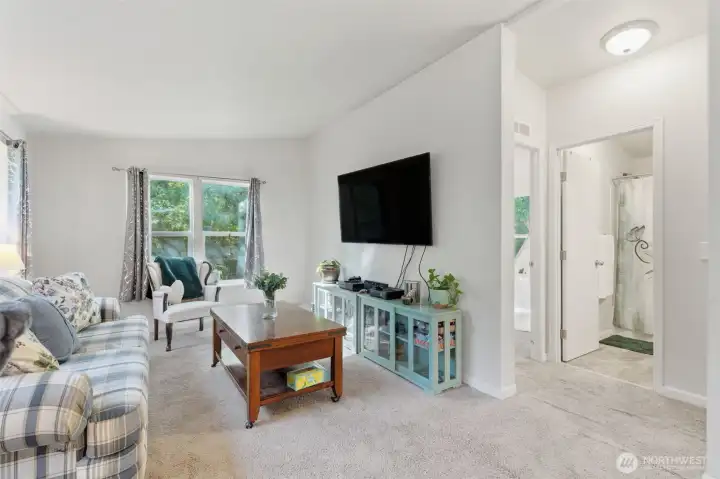 Living room leads to second bathroom and two bedrooms