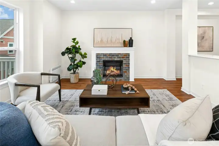 Open concept living area with gas fireplace.