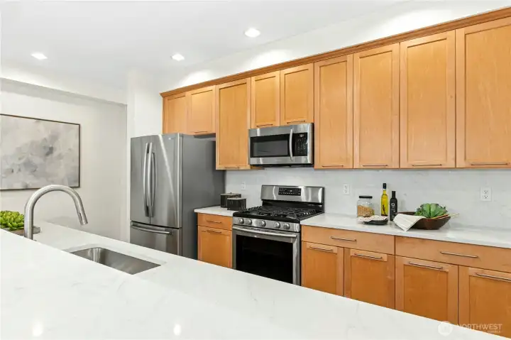 Large galley kitchen with new Quartz countertops.