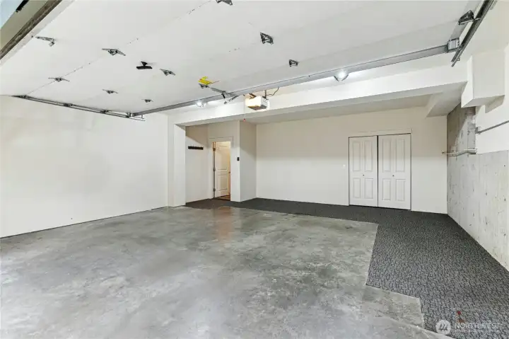 Oversized 2 car garage with large closet, upgraded tankless water heater, and plenty of space for home gym or storage racks!