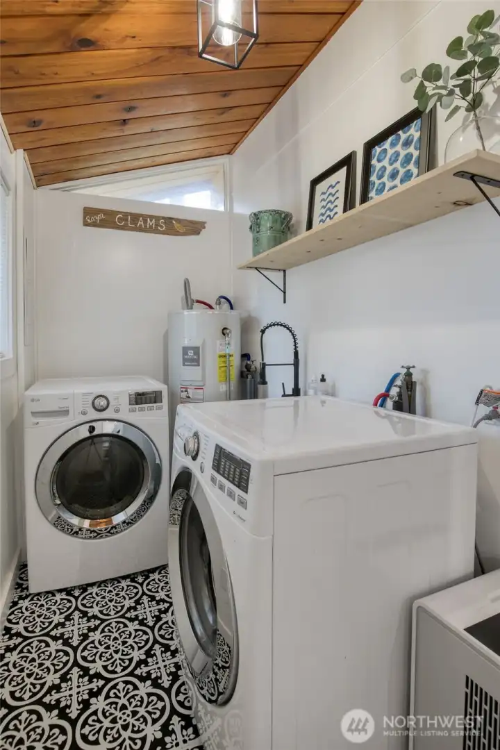Laundry room with new paint, flooring, light fixture and utility sink