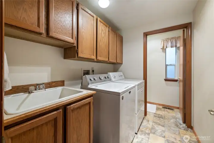 The main floor has a large utility room and a convenient 1/2 bath.