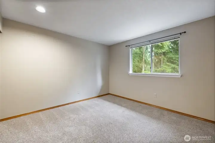 The second bedroom is also a great size with a view of the backyard.