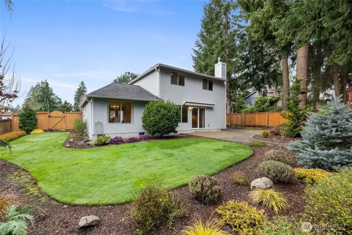 The large backyard is beautifully landscaped and fully fenced.