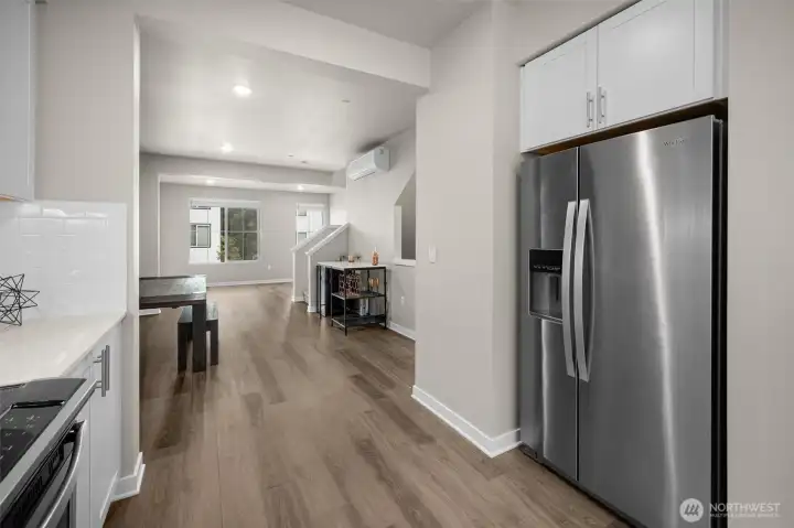Great view from the kitchen of the dining room area and living room up front. On the wall near the ceiling is the mini split for heat and a/c.