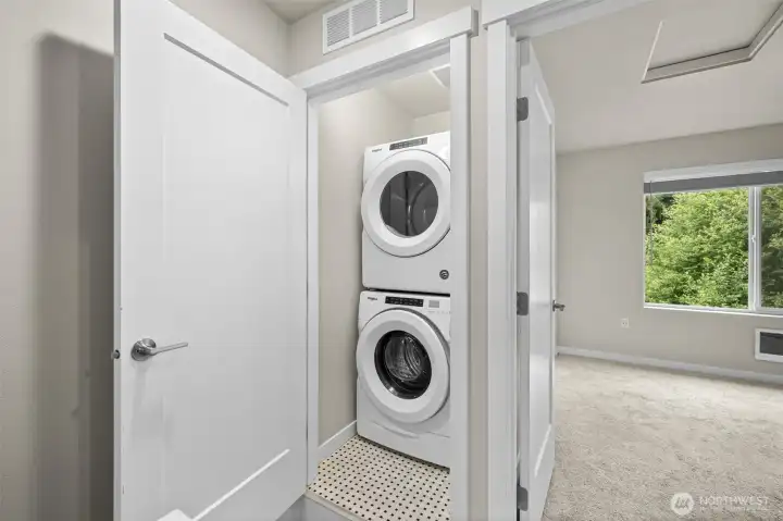 Upstairs laundry closet, stacked washer/dryer unit stays with the home.