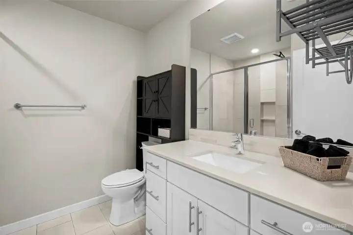 Upstairs full bath w/tile flooring, huge shower and plenty of space for linens and towels.
