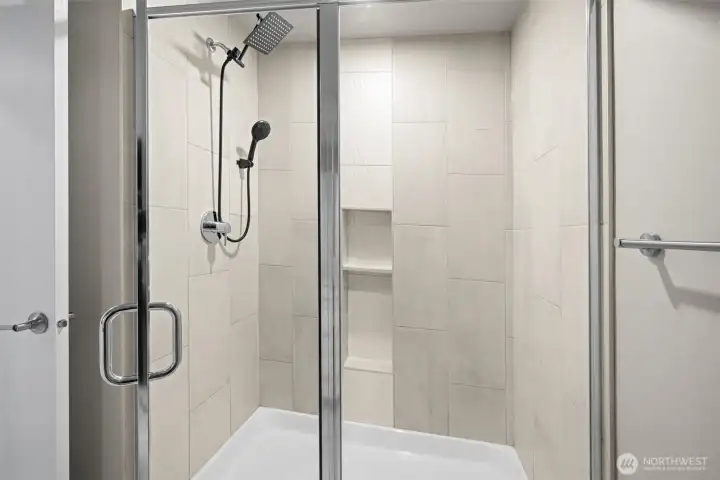 Fully wrapped tile shower.