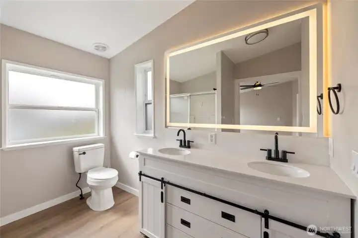 Updated 3/4 bathroom with lit LED mirror and new vanity