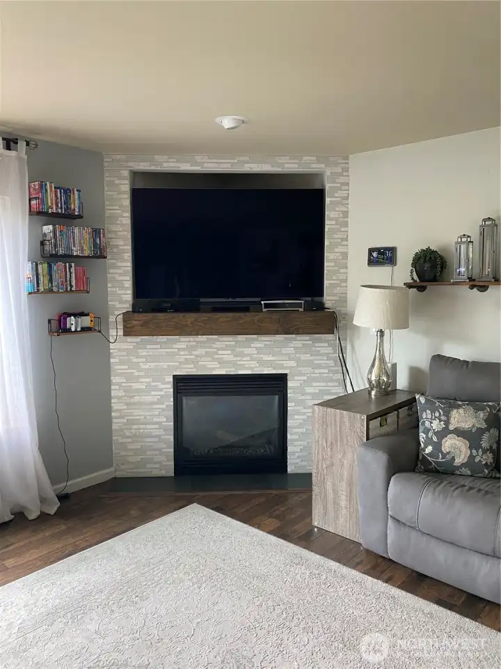 Fireplace wall tiled with new mantel!