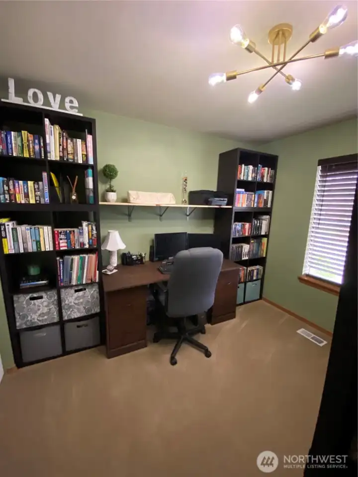 Main floor bedroom, currently being used as an office! Desk and shelving built in and will stay for new owner.