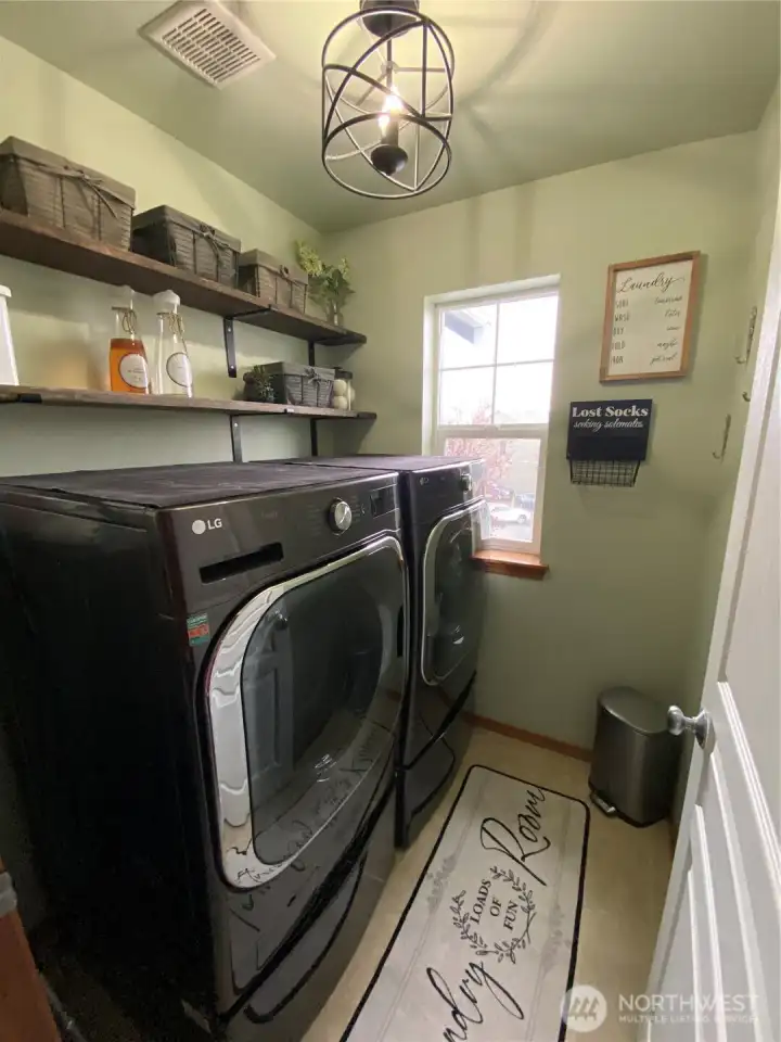 Laundry room with new flooring, paint, light fixture and shelving!