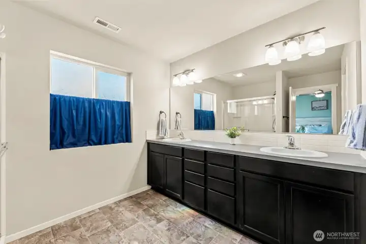 Primary Bathroom 11'x9' with walk-in closet 8'x7'.
